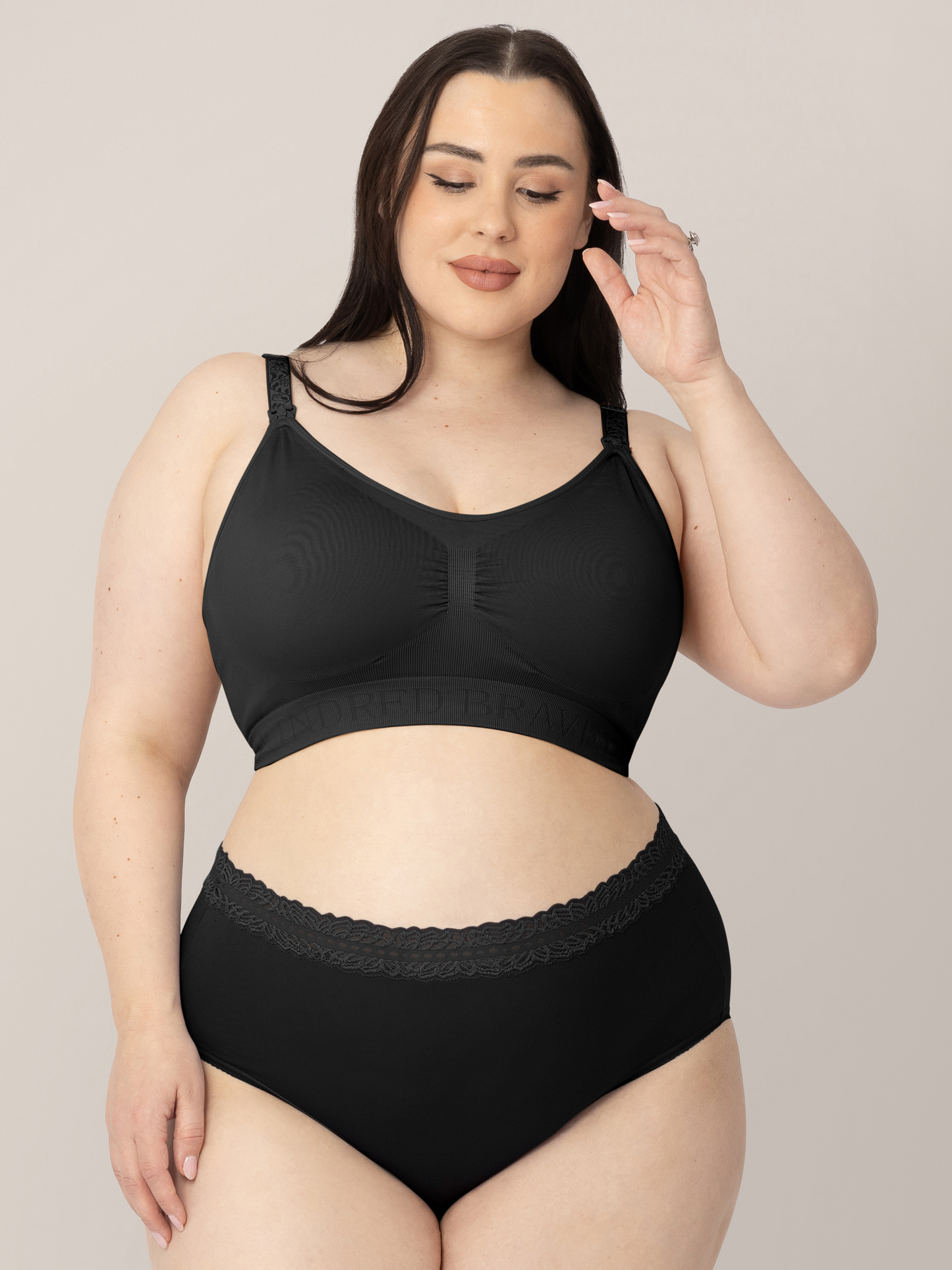 Model wearing the Simply Sublime® Nursing Bra in Black  with her hand in her hair. @model_info:Rachel is wearing an X-Large Busty.