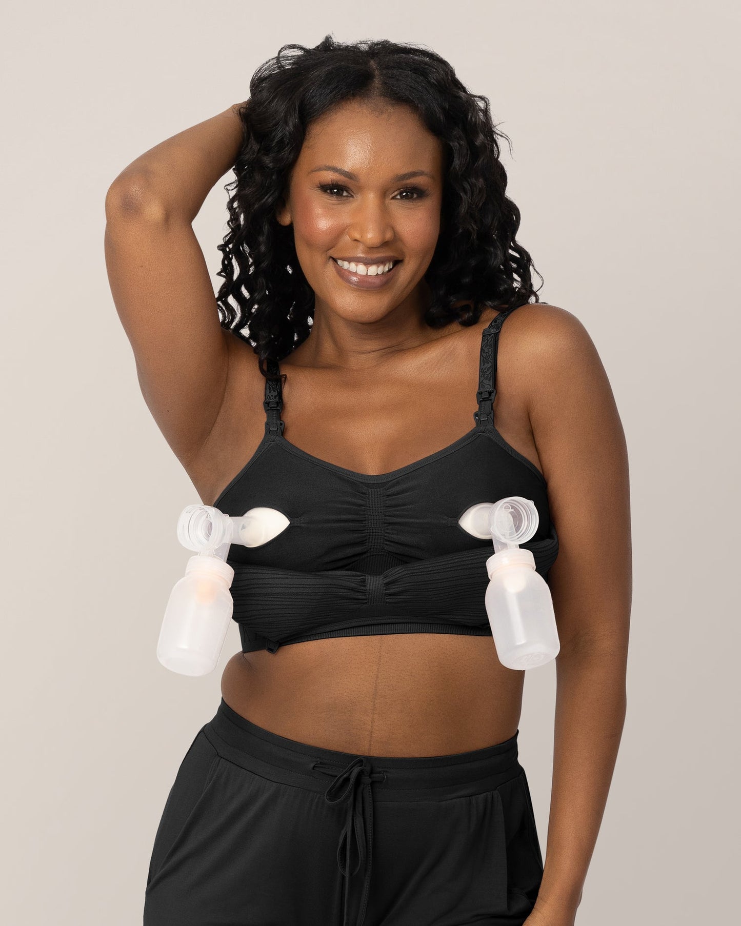 Model wearing the Sublime® Hands-Free Pumping & Nursing Bra in Black @model_info:Rashé is wearing a Large.
