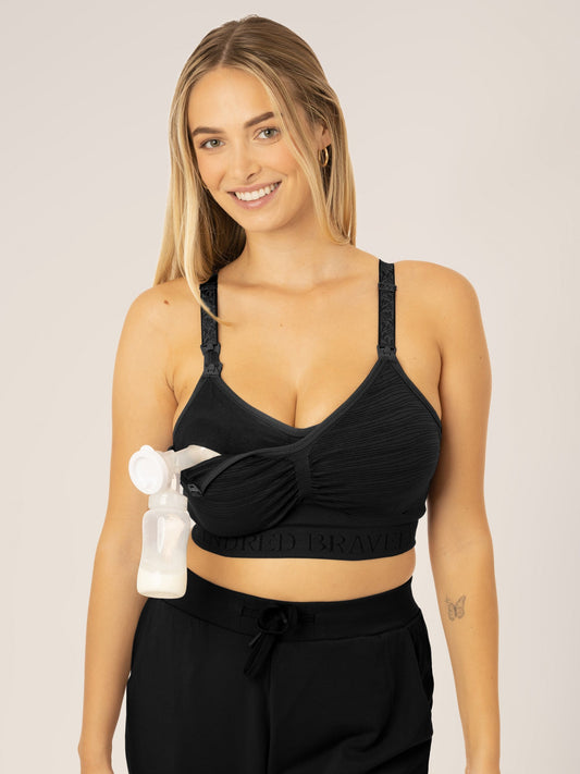 Busty model wearing the Sublime® Hands-Free Pumping & Nursing Bra in Black